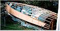 Single skin to sides fitted on Didi 38 radius chine plywood boat for amateur boatbuilders